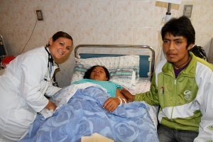 Dr Katie Gualandri with her patient and husband a day after she delivered their baby by c-section