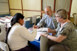 Dr. Tony Cirrincone and Translater Kathleen Leggdas work with a patient in the outpatient gynecology clinic.